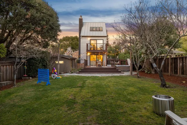 a view of a two chairs in a yard