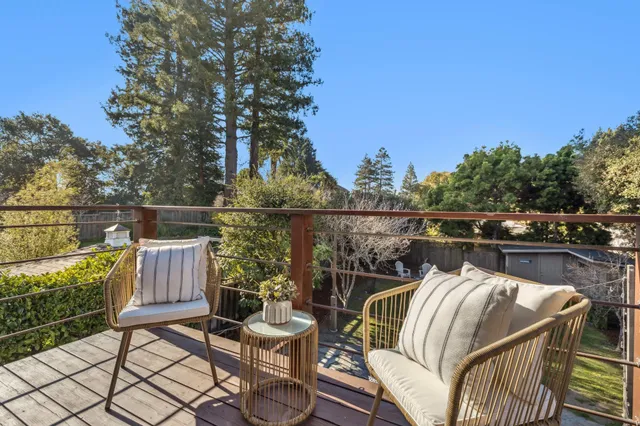 a view of a house with backyard sitting area and garden