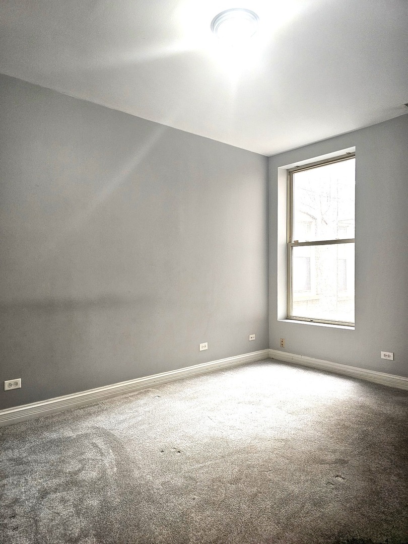 1520 East Marquette Road, Unit 2B Chicago, IL 60637 - Photo 30 of 44 an empty room with a window