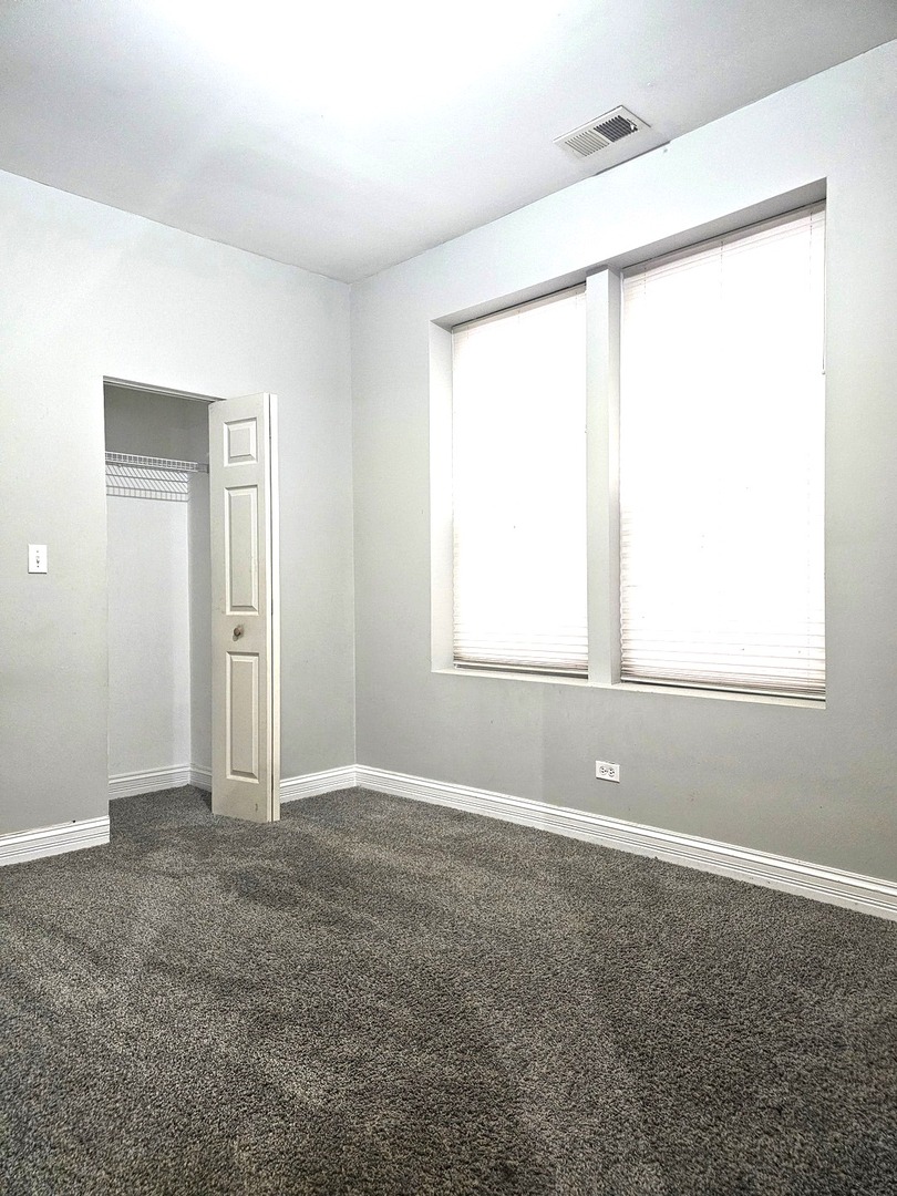 1520 East Marquette Road, Unit 2B Chicago, IL 60637 - Photo 35 of 44 a view of an empty room with a window