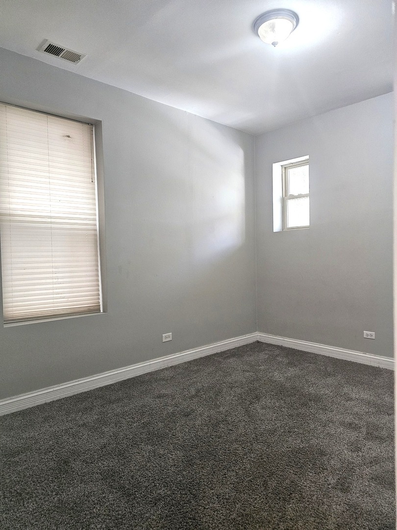 1520 East Marquette Road, Unit 2B Chicago, IL 60637 - Photo 36 of 44 an empty room with a window