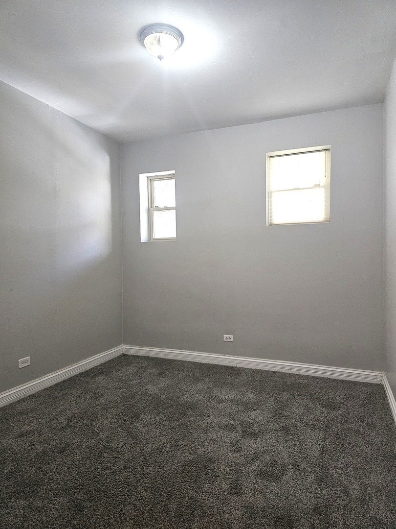 1520 East Marquette Road, Unit 2B Chicago, IL 60637 - Photo 42 of 44 an empty room with a window