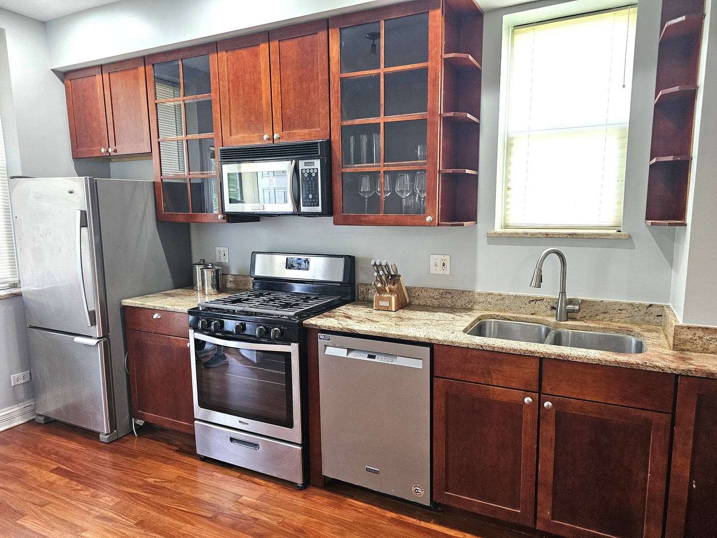 1520 East Marquette Road, Unit 2B Chicago, IL 60637 - Photo 10 of 44 a kitchen with stainless steel appliances granite countertop a sink stove and refrigerator