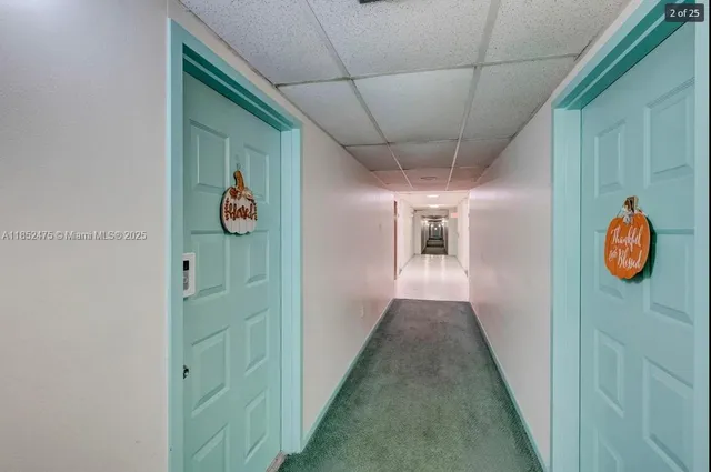a view of a street with a cars parked in front of it