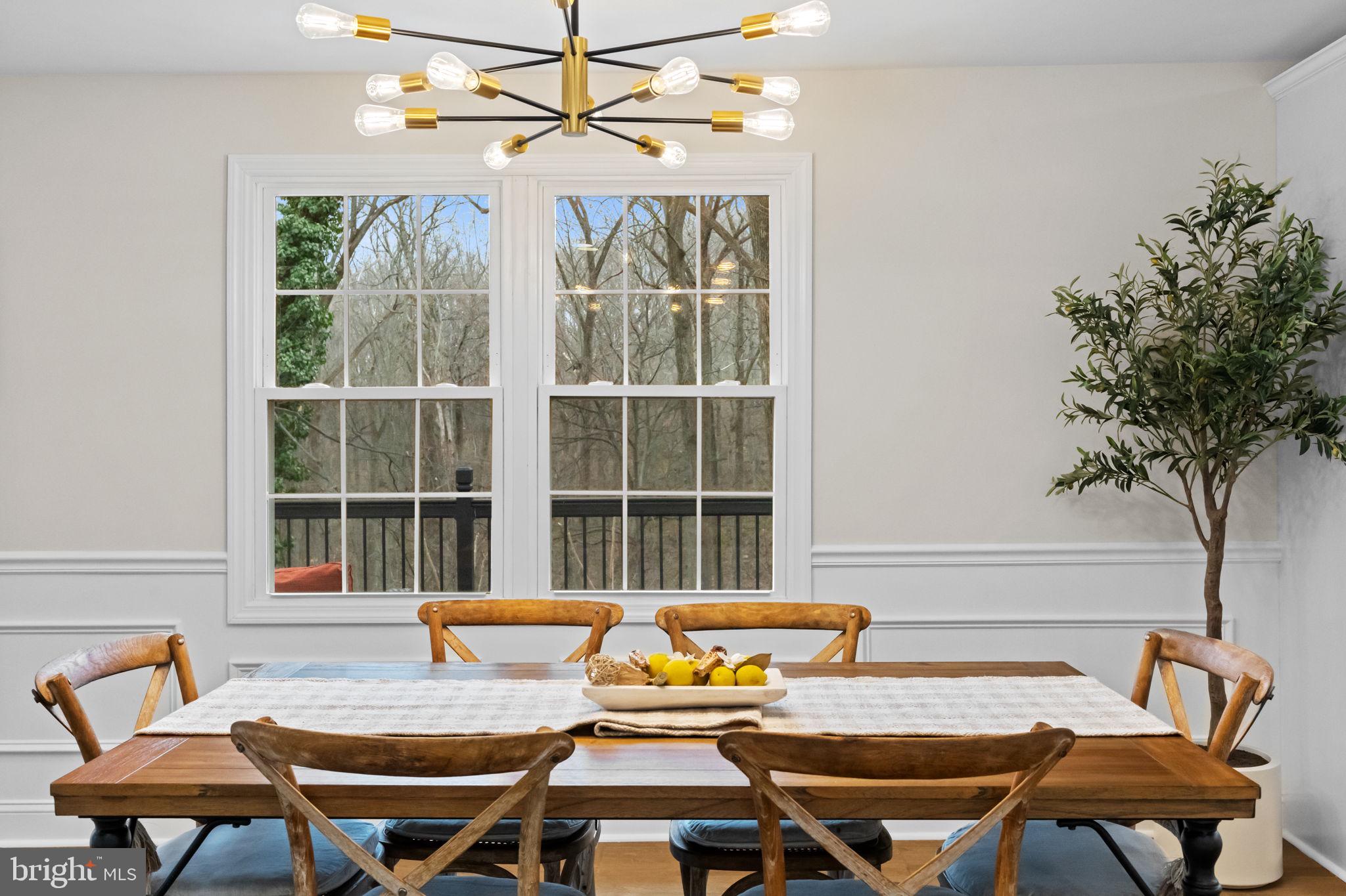 971 Stevens Lane Wayne, PA 19087 - Photo 14 of 66 a view of a dining room with furniture and a potted plant