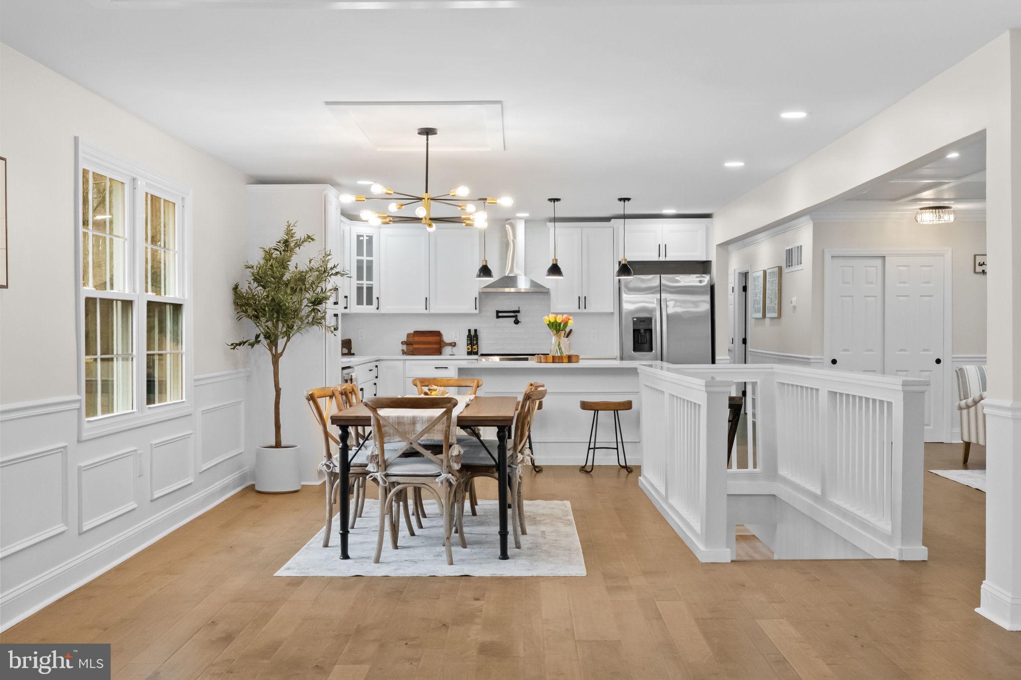 971 Stevens Lane Wayne, PA 19087 - Photo 15 of 66 a view of a dining room with furniture and wooden floor