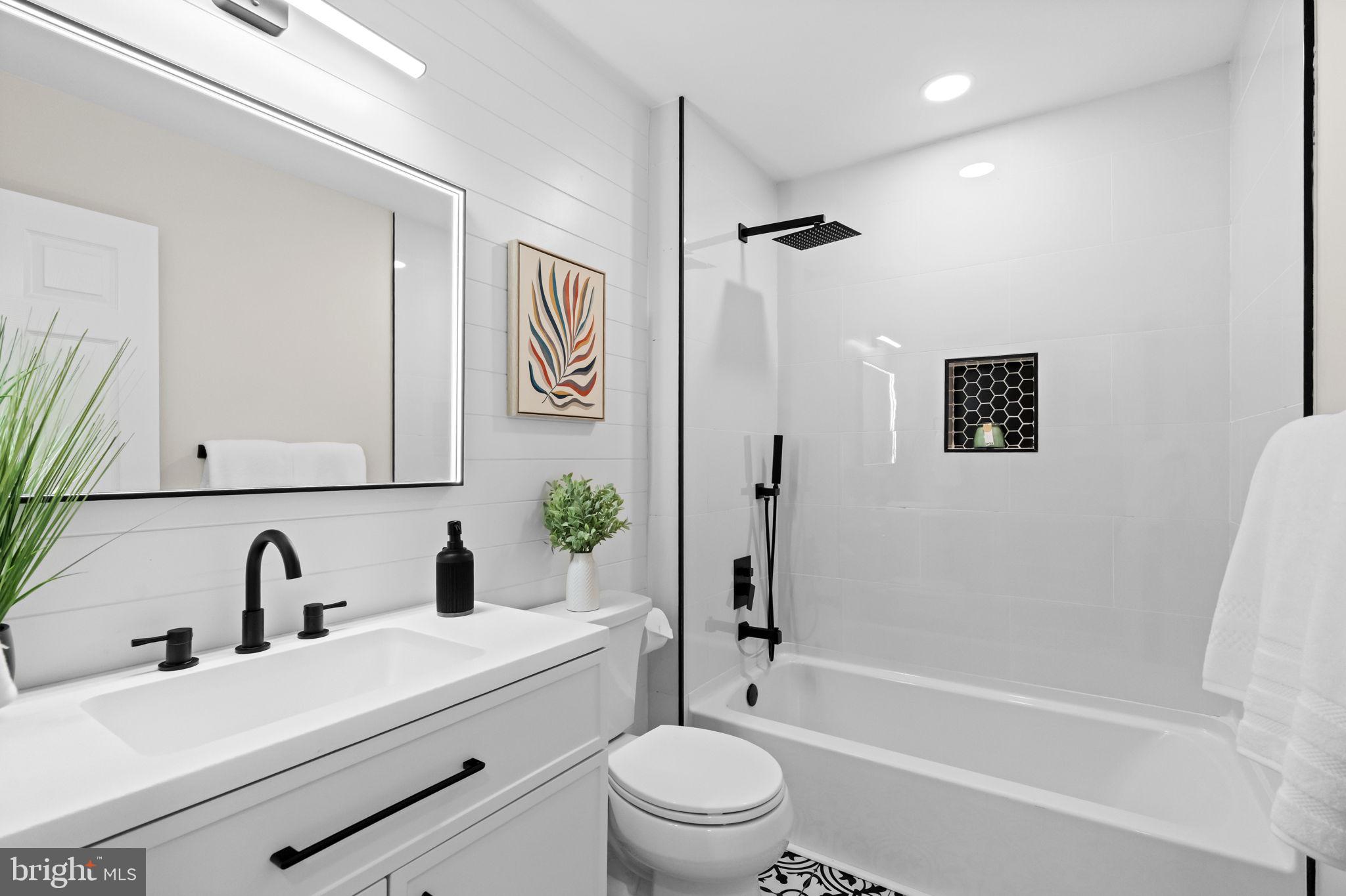 971 Stevens Lane Wayne, PA 19087 - Photo 32 of 66 a bathroom with a sink a toilet and shower