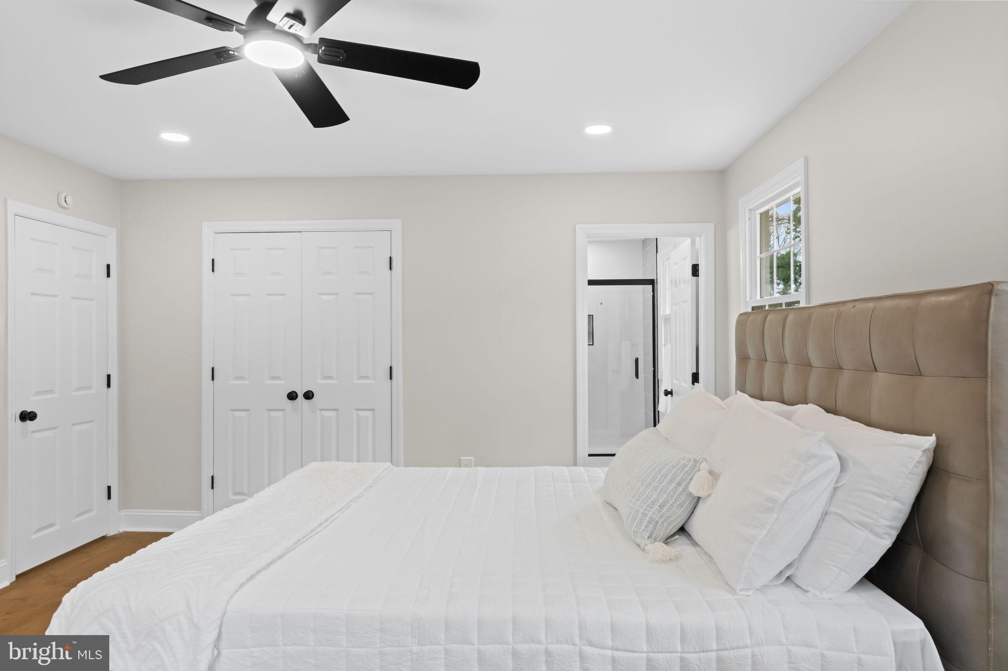 971 Stevens Lane Wayne, PA 19087 - Photo 35 of 66 a bedroom with a bed and a ceiling fan