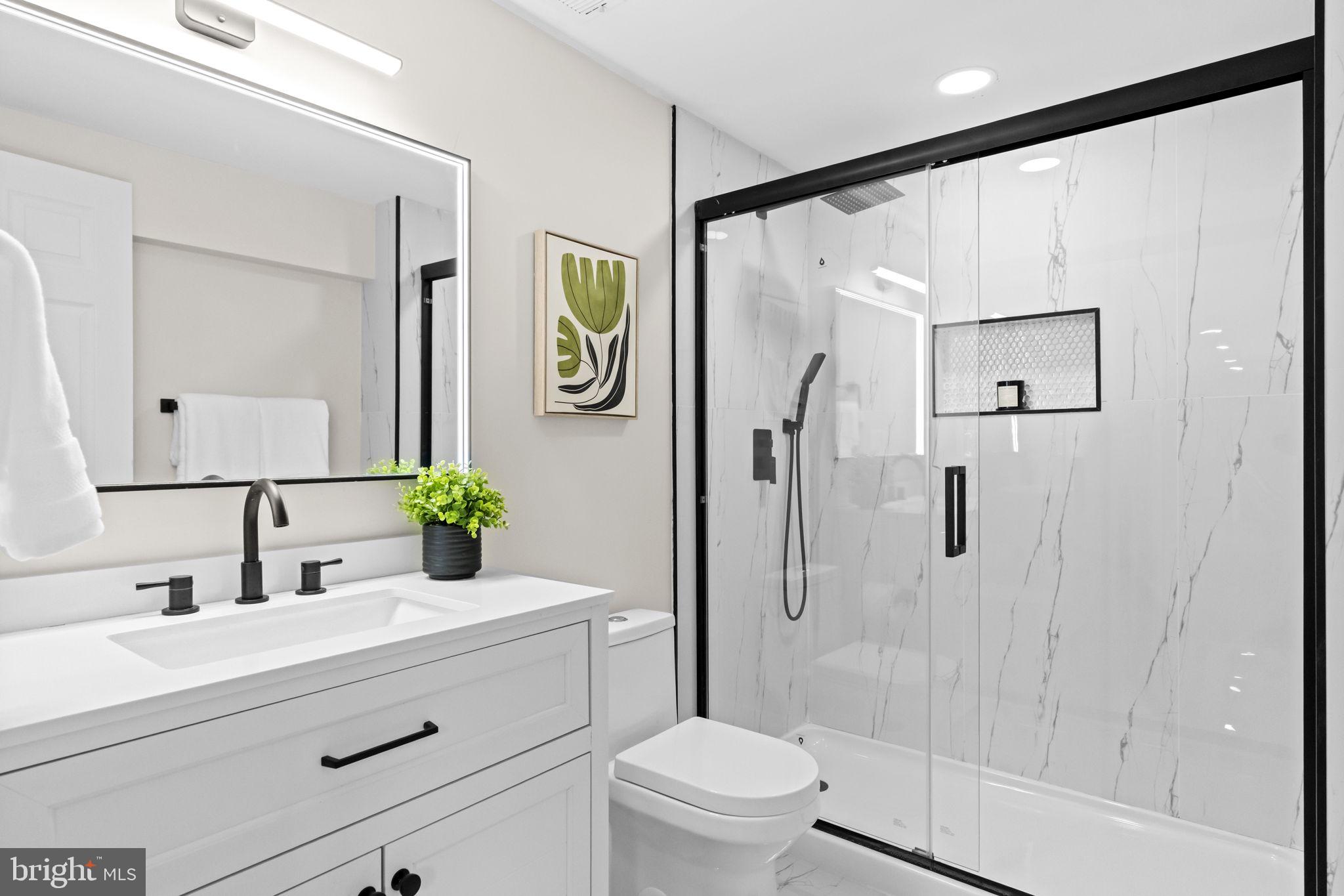 971 Stevens Lane Wayne, PA 19087 - Photo 44 of 66 a bathroom with a sink mirror vanity and toilet