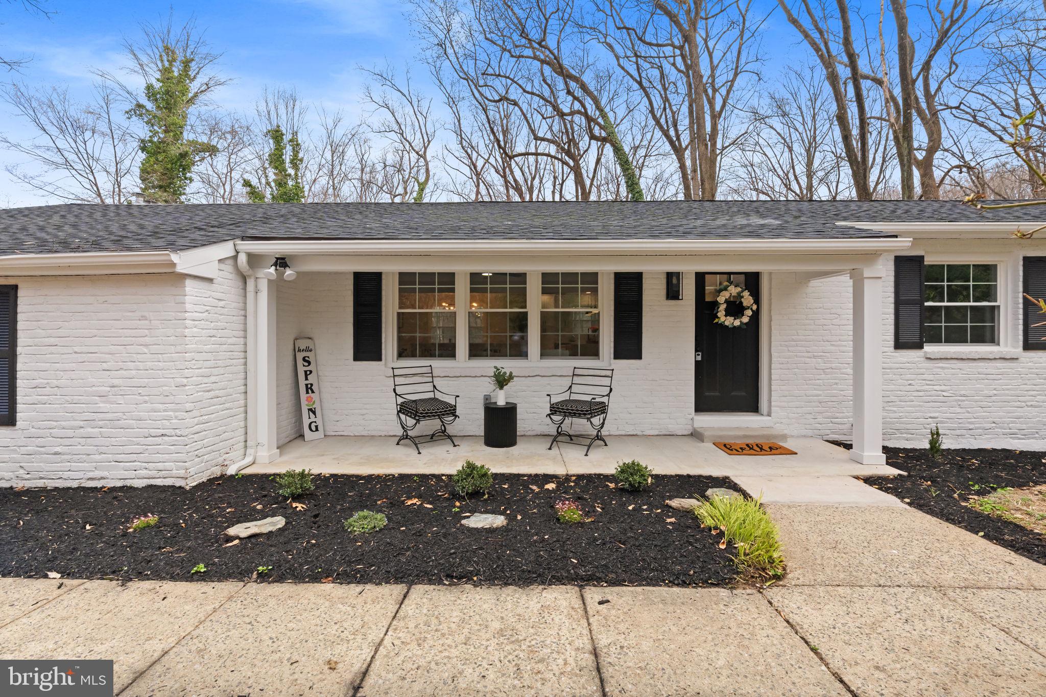 971 Stevens Lane Wayne, PA 19087 - Photo 5 of 66 a front view of a house with a bench