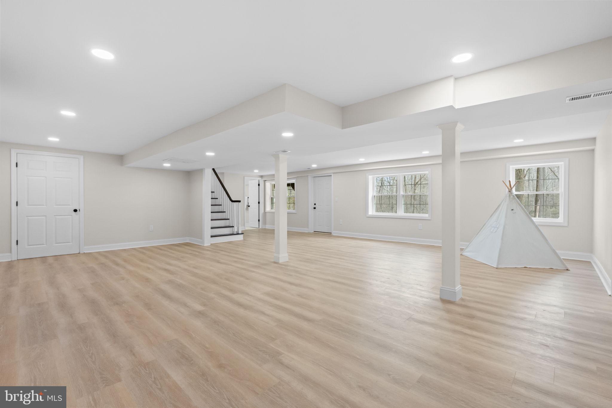 971 Stevens Lane Wayne, PA 19087 - Photo 52 of 66 a view of empty room with wooden floor and windows