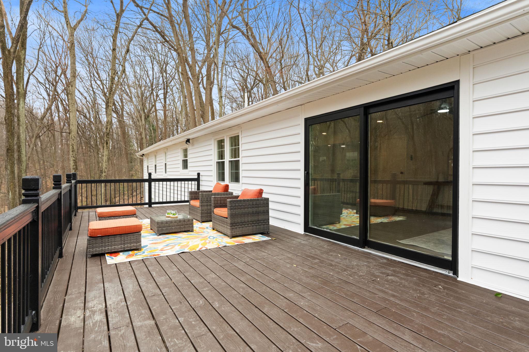 971 Stevens Lane Wayne, PA 19087 - Photo 57 of 66 a balcony with wooden floor and iron stairs