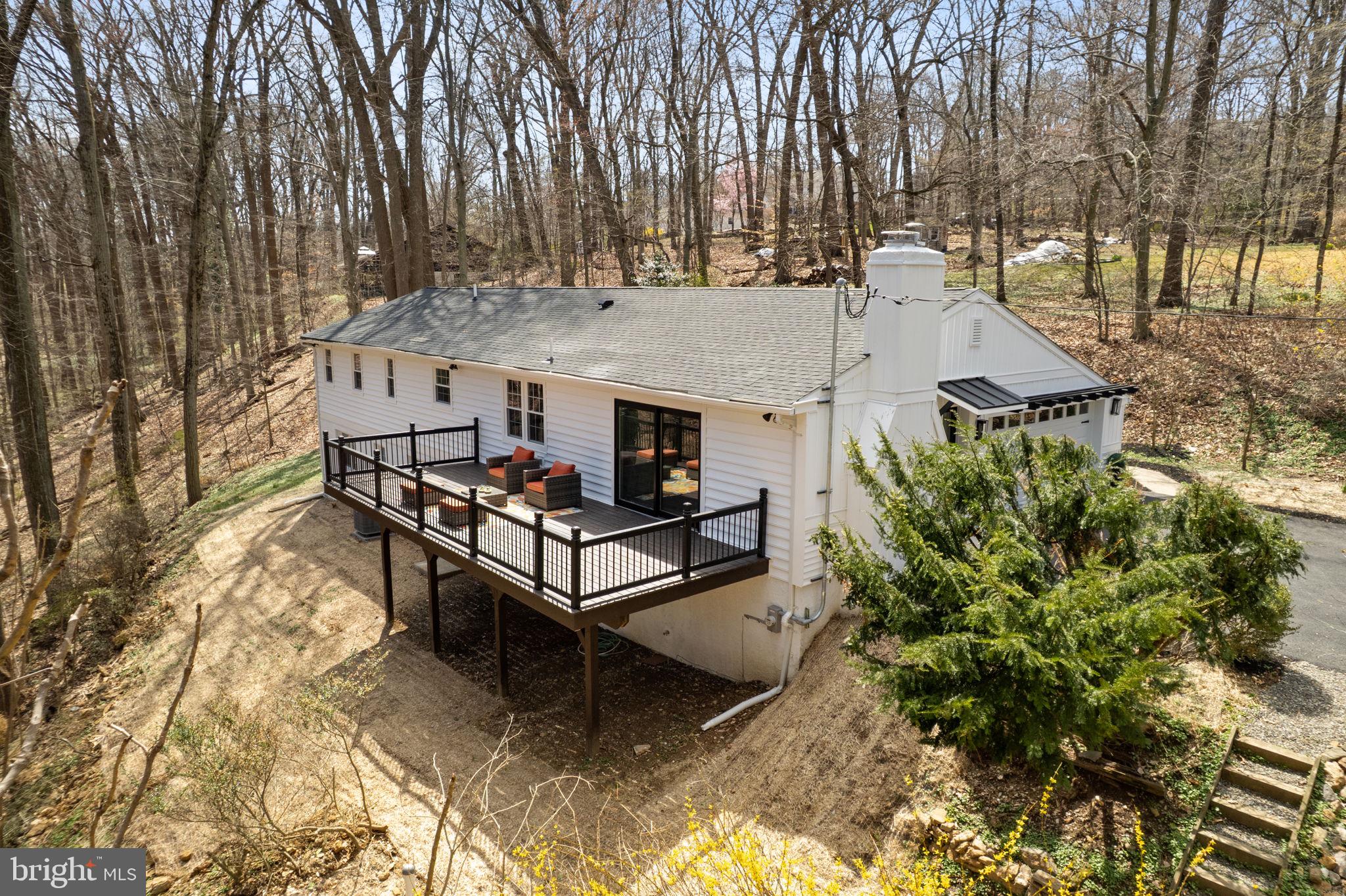 971 Stevens Lane Wayne, PA 19087 - Photo 59 of 66 a roof deck with table and chairs under an umbrella