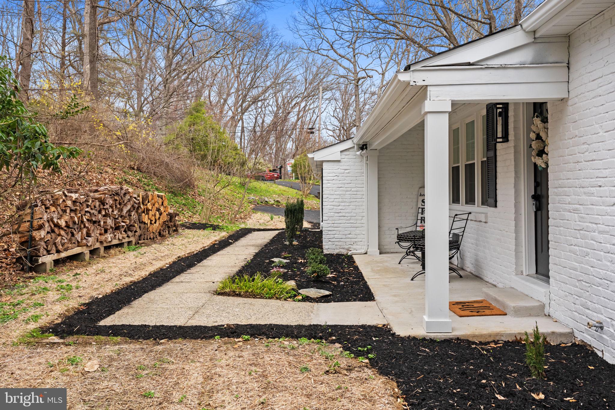 971 Stevens Lane Wayne, PA 19087 - Photo 7 of 66 a front view of a house with garden