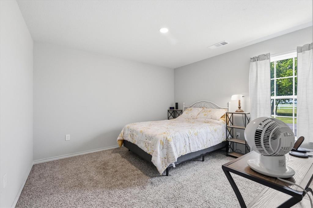 110 Highview Road Ennis, TX 75119 - Photo 24 of 40 Carpeted room with a recessed ceiling light, white walls, and a window with white trim