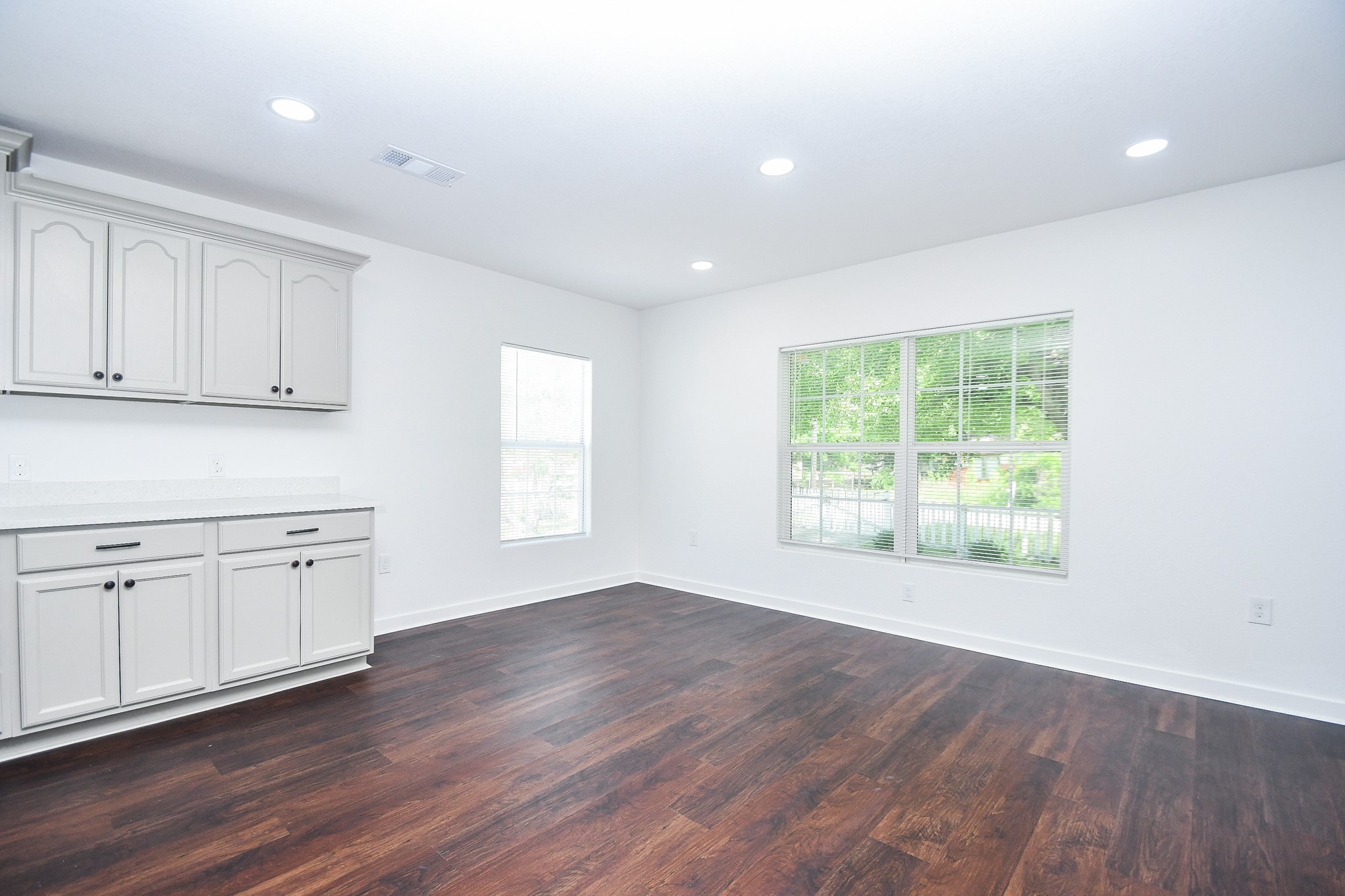 2636 Lone Oak Road Houston, TX 77093 - Photo 15 of 42 White and gray cabinets and ample natural light, creating a welcoming and versatile space.