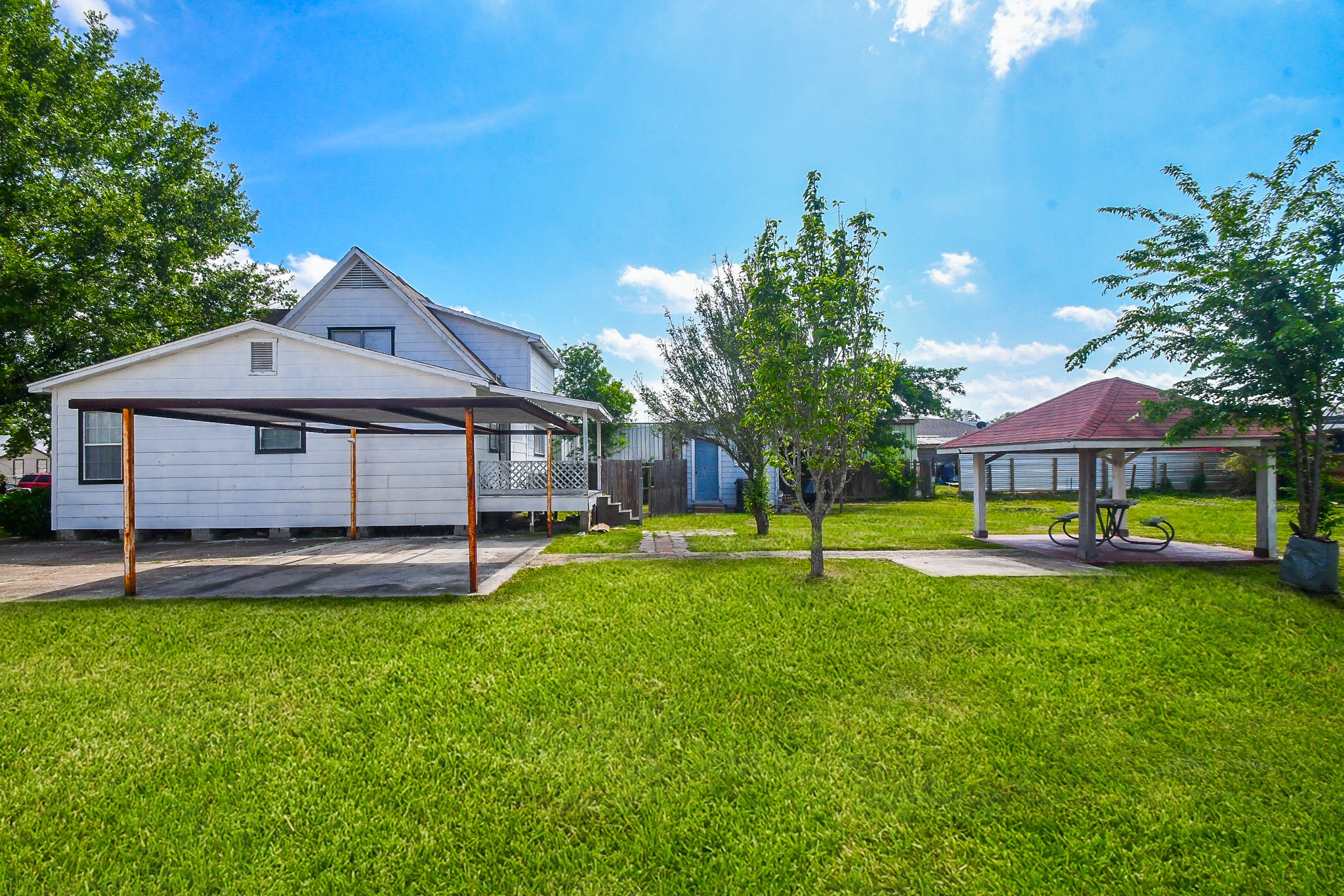 2636 Lone Oak Road Houston, TX 77093 - Photo 9 of 42 The property is surrounded by greenery and offers ample outdoor space for relaxation and activities.