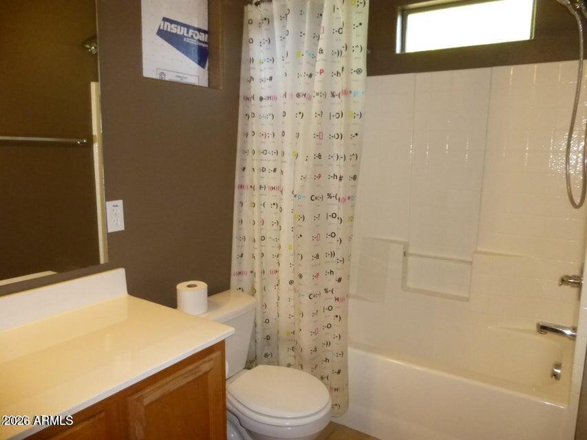 2727 North Price Road, Unit 28 Chandler, AZ 85224 - Photo 10 of 14 a bathroom with a toilet and a shower curtain