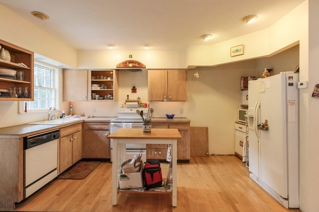 186 Sterling Road Lancaster, MA 01523 - Photo 13 of 40 a kitchen with a sink appliances and cabinets