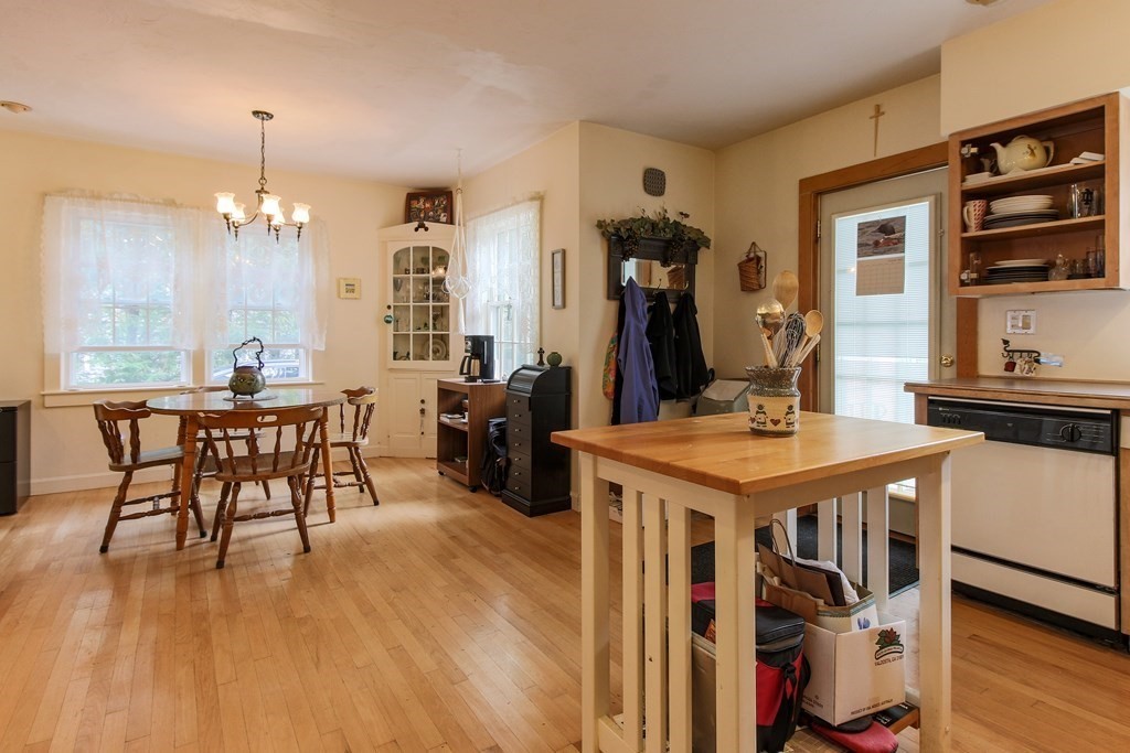 186 Sterling Road Lancaster, MA 01523 - Photo 15 of 40 a view of a dining room with furniture and wooden floor