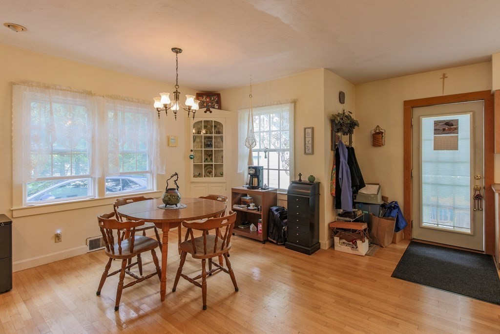 186 Sterling Road Lancaster, MA 01523 - Photo 16 of 40 a view of a dining room with furniture window and wooden floor