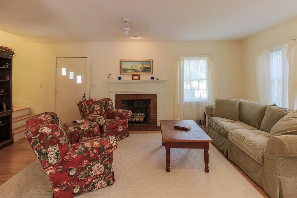 186 Sterling Road Lancaster, MA 01523 - Photo 17 of 40 a living room with furniture and a fireplace