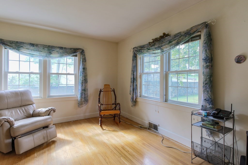 186 Sterling Road Lancaster, MA 01523 - Photo 20 of 40 a living room with furniture and a window