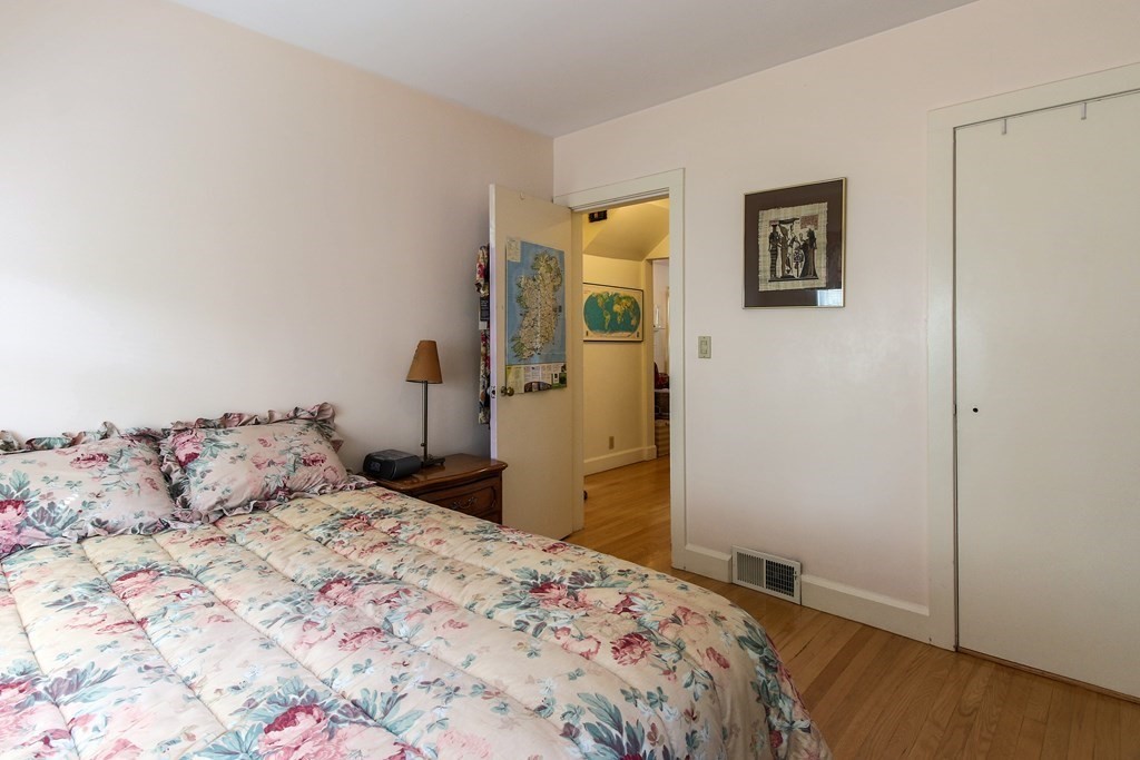 186 Sterling Road Lancaster, MA 01523 - Photo 22 of 40 a bedroom with a bed and a cabinets