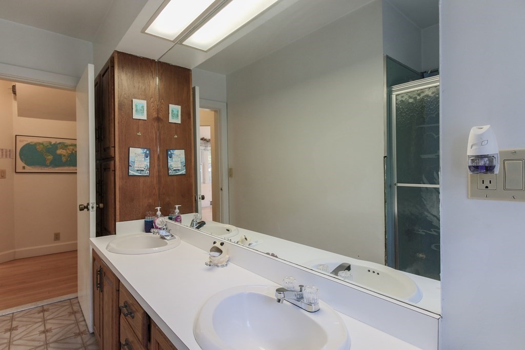 186 Sterling Road Lancaster, MA 01523 - Photo 26 of 40 a bathroom with a sink and a mirror