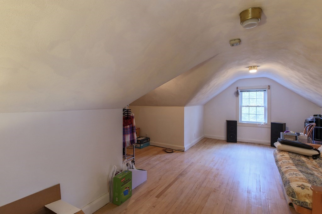 186 Sterling Road Lancaster, MA 01523 - Photo 31 of 40 a view of empty room with wooden floor and fan