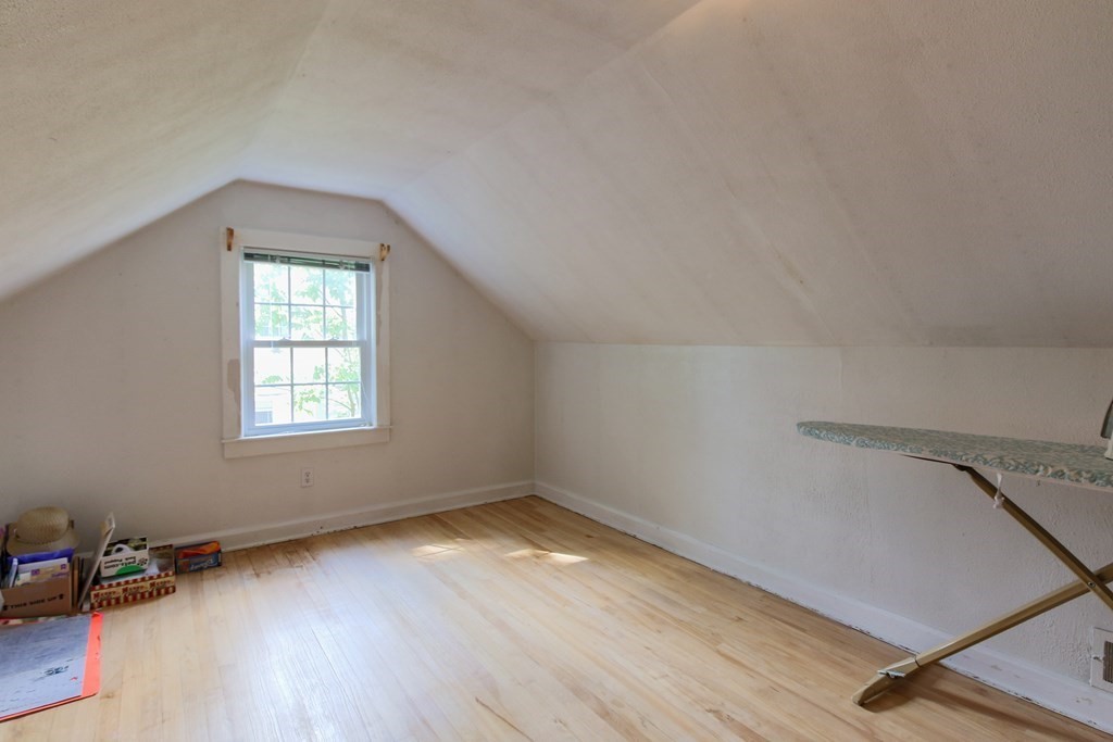 186 Sterling Road Lancaster, MA 01523 - Photo 32 of 40 an empty room with wooden floor and windows