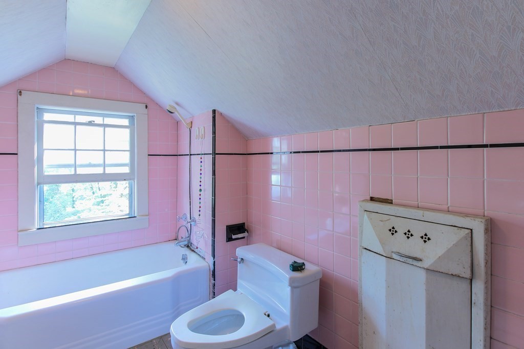 186 Sterling Road Lancaster, MA 01523 - Photo 33 of 40 a bathroom with a sink toilet vanity and bathtub