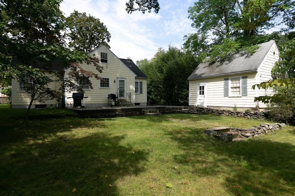 186 Sterling Road Lancaster, MA 01523 - Photo 4 of 40 a front view of house with yard and green space