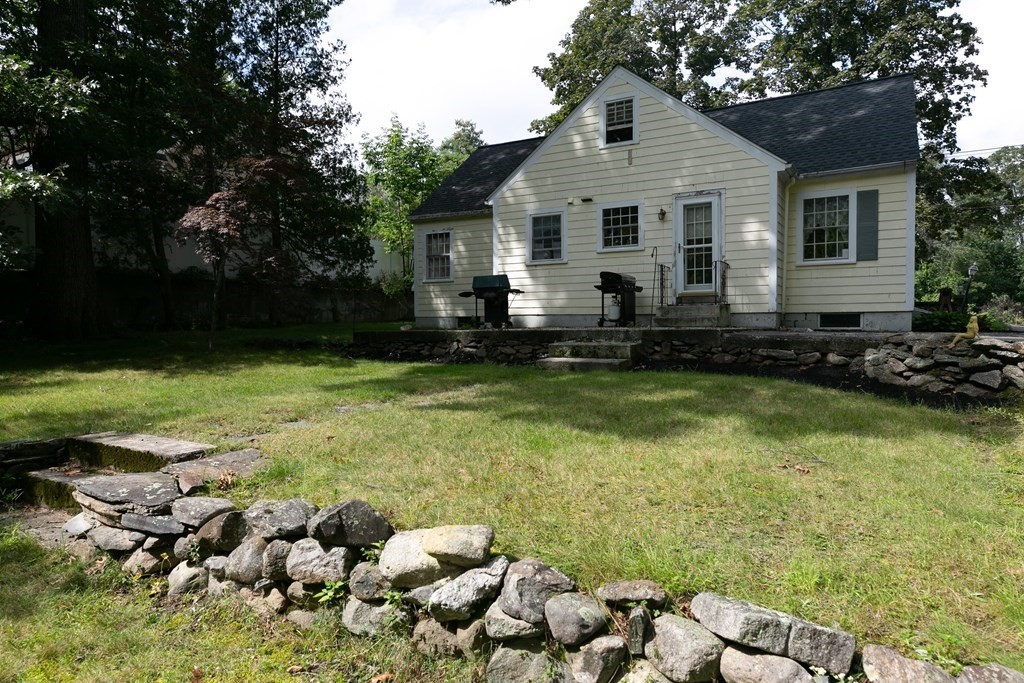 186 Sterling Road Lancaster, MA 01523 - Photo 5 of 40 a front view of a house with a yard