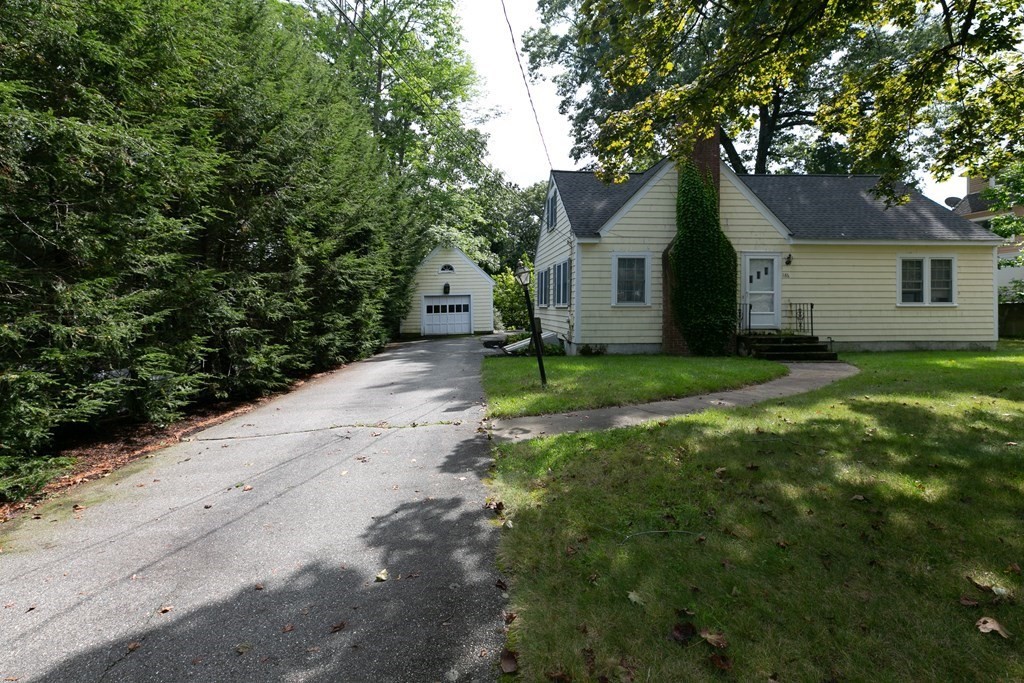 186 Sterling Road Lancaster, MA 01523 - Photo 6 of 40 a house that has tree in front of it