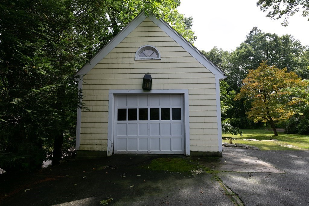 186 Sterling Road Lancaster, MA 01523 - Photo 7 of 40 a view of a small house in the back yard