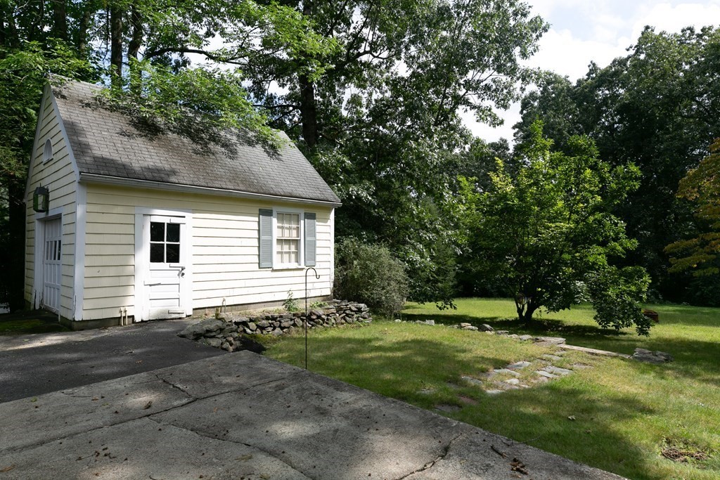 186 Sterling Road Lancaster, MA 01523 - Photo 8 of 40 a house with trees in the background