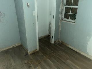 240 South 4th Street Slaton, TX 79364 - Photo 2 of 9 wooden floor in an empty room
