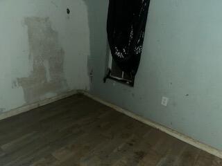 240 South 4th Street Slaton, TX 79364 - Photo 3 of 9 an empty room with a window