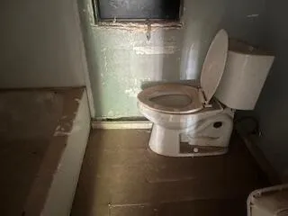 a view of a toilet in a bathroom
