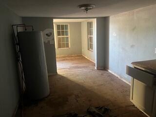 240 South 4th Street Slaton, TX 79364 - Photo 5 of 9 a view of an empty room with a fireplace