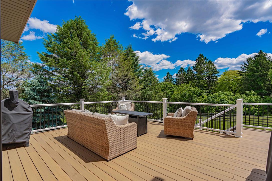 6000 Pond View Terrace Bath, PA 18014 - Photo 51 of 69 An inviting outdoor deck provides scenic, tree-lined views, perfect for relaxation or entertaining.