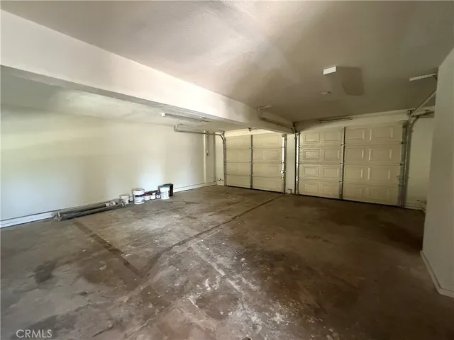 a view of a room with gym equipment and windows