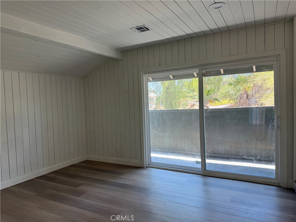 2390 Prenda Avenue Riverside, CA 92504 - Photo 20 of 41 a view of a room with wooden floor and doors