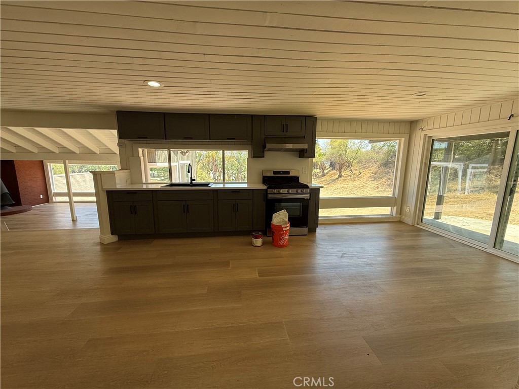 2390 Prenda Avenue Riverside, CA 92504 - Photo 32 of 41 an empty room with wooden floor and windows