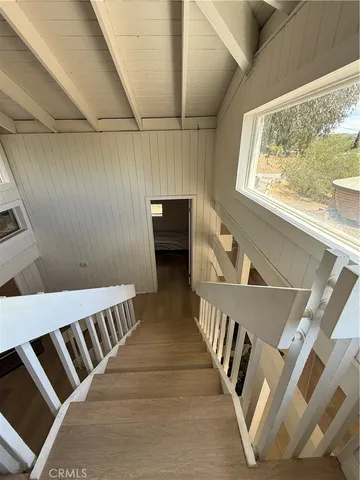 a view of balcony with deck and wooden floor