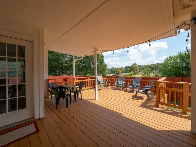 a view of a balcony with chairs