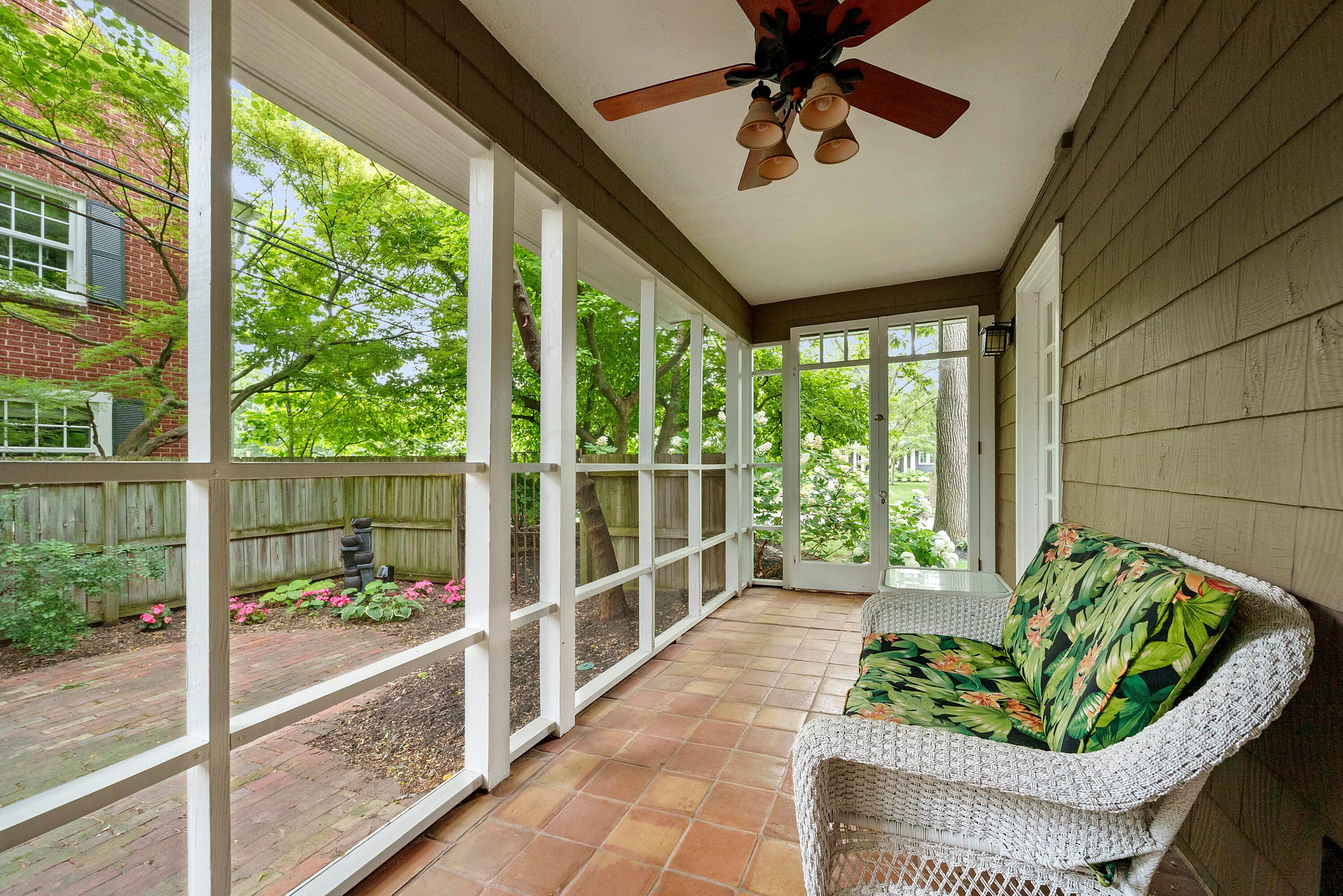 1907 North Devon Road Columbus, OH 43212 - Photo 8 of 44 Screened in porch with access to the private side yard and brick paver patio.