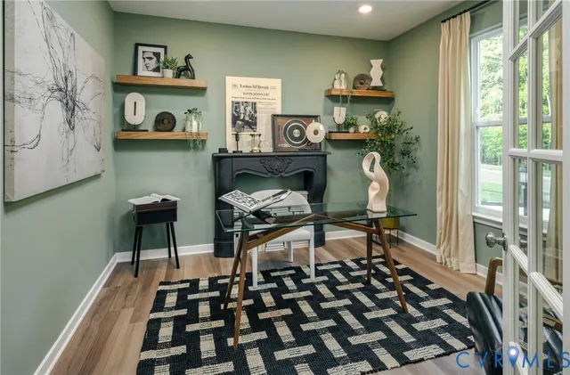 a bedroom with furniture and a window