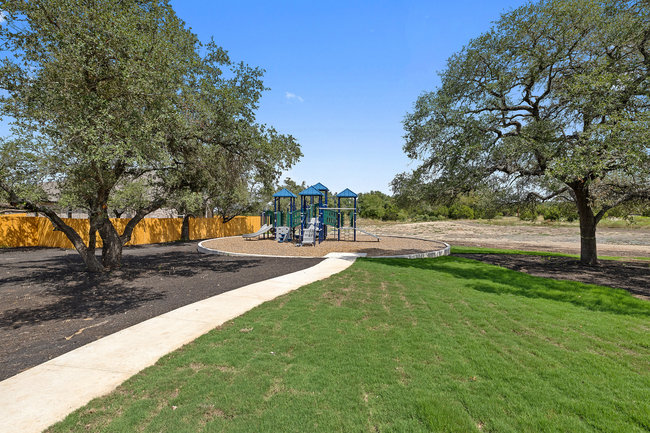 1917 Lazy Acrs Street Leander, TX 78641 - Photo 19 of 20 a view of green field with large trees